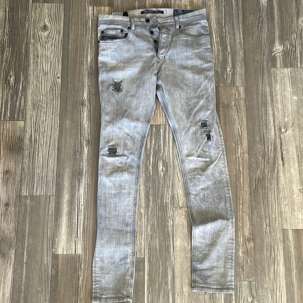 Brand New Diesel Jeans. Never Worn. Light Grey with Black buttons. W 30 L 32